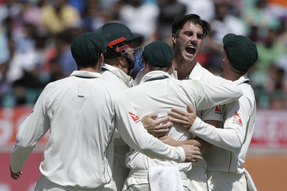 Pat Cummins celebrates a wicket on the 2017 India tour.