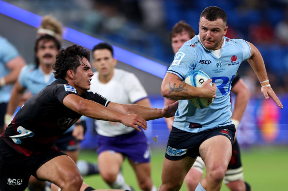 Waratahs winger Dylan Pietsch takes a carry. 