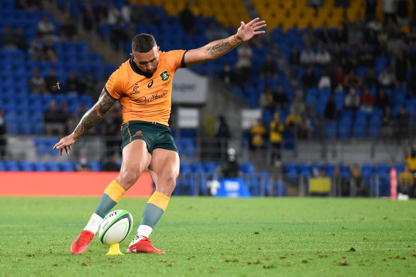 Cooper lines up the match-winning penalty on the Gold Coast.