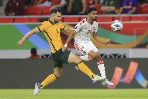 Bailey Wright challenges UAE winger Harib Suhail Al Maazmi.