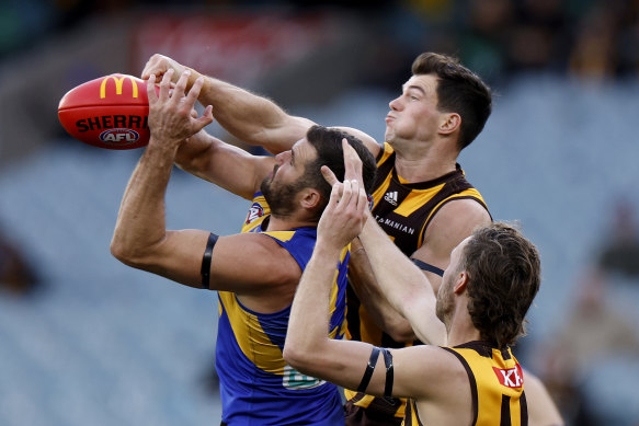 Jack Darling and Jaeger O’Meara  contest a mark.