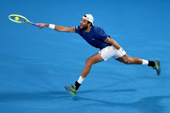 Matteo Berrettini of Italy stretches against Stefanos Tsitsipas of Greece  in Sydney on Saturday night.