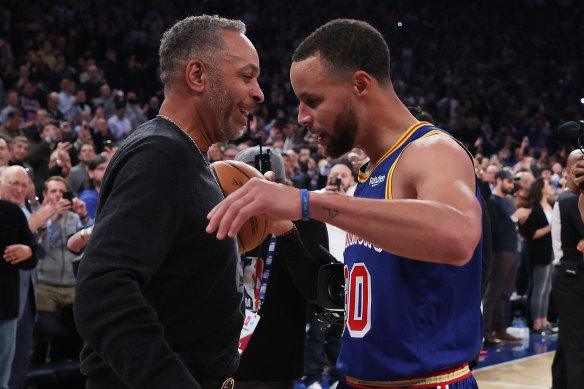 Steph Curry shares the moment with his father Dell.