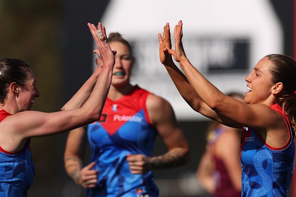 Melbourne Demons celebrate their emphatic win over Brisbane 

