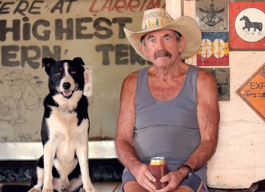 Paddy Moriarty and canine friend seen on the cover of a book by David Darcy about blokes and dogs.