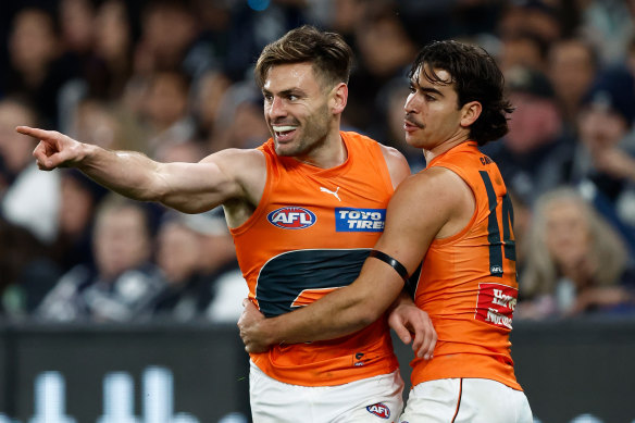 Stephen Coniglio and Toby Bedford of the Giants celebrate during the Round 24 match against Carlton