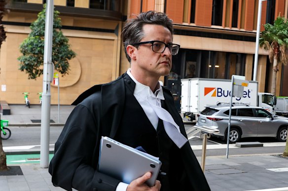 The ACCC’s lead barrister Michael Hodge KC enters Federal Court.
