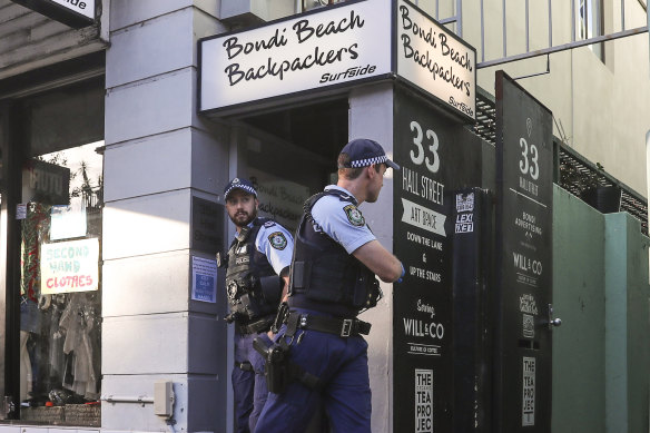 Police leave the Bondi Beach Backpackers after breaking up a public indoor gathering on Friday night. 