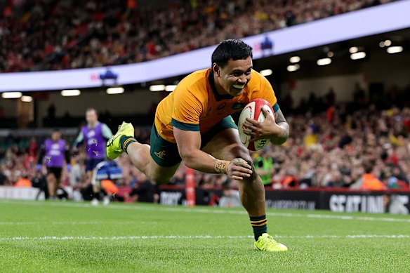 Len Ikitau scores a try against Wales in November 2024.