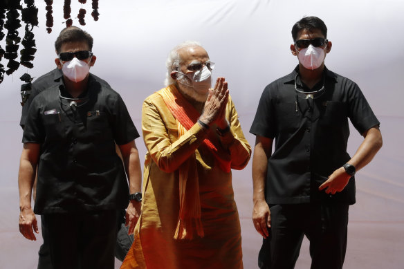 Indian Prime Minister Narendra Modi, centre, arrives for the groundbreaking ceremony of a temple dedicated to the Hindu god Ram, in Ayodhya.