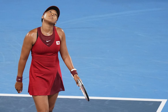 Naomi Osaka, of Japan, reacts during a third round women’s tennis match against Marketa Vondrousova, of the Czech Republic, at the Tokyo Olympics.