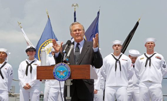 Former US defence secretary Donald Rumsfeld speaks to sailors on the deck of the USS McCampbell in 2006. 