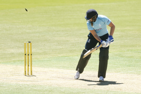 Sophie Ecclestone of England is bowled by Annabel Sutherland.