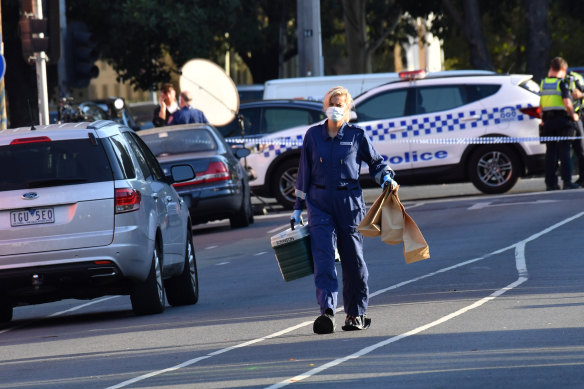 Police at the scene of the fatal shooting outside the Melbourne Pavilion in Kensington in March last year.