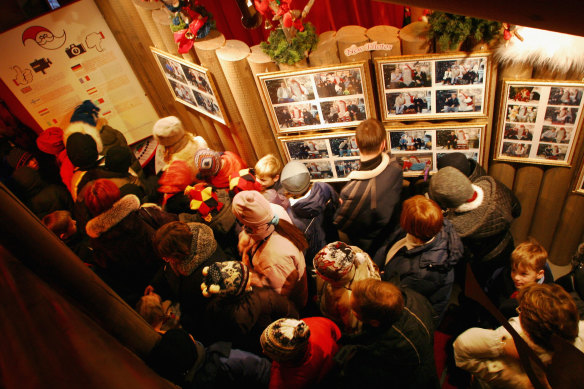 Visitors queue to meet Santa Claus at the Santa Claus Village.
