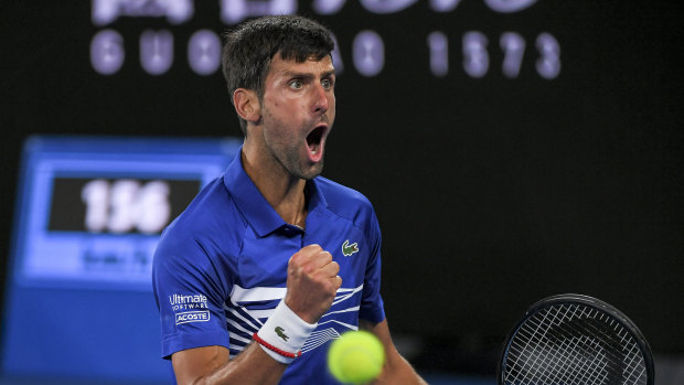 Belligerent: Novak Djokovic wins a key point as he steamrolls Rafael Nadal on centre court.