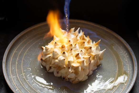 Bombe Alaska for two, its meringue torched at the table.