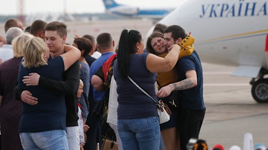 Relatives of Ukrainian prisoners freed by Russia greet them upon their arrival un Ukraine.
