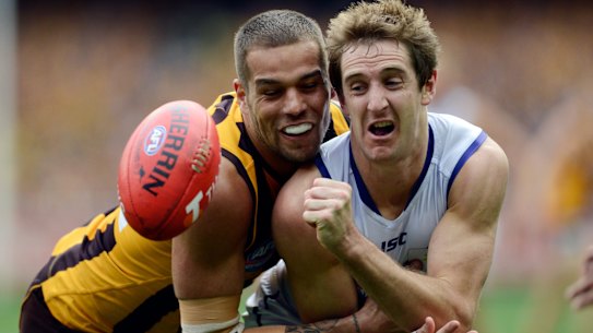 Barlow, pictured here coming up against legendary forward Lance “Buddy” Franklin in the 2013 grand final, always put his body on the line.