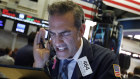 A New York trader reacts as stocks plunge on August 5.