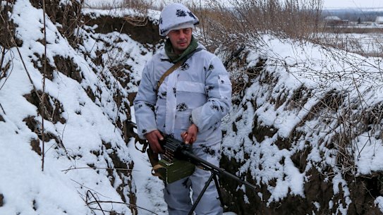 A Ukrainian serviceman stands in a trench on territory controlled by pro-Russian militants in eastern Ukraine.