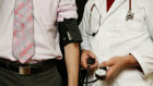 A medical exam is just one of the safety checks before an overseas assignment.