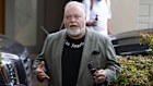 Kyle Sandilands addresses media outside his Vaucluse home on Tuesday.