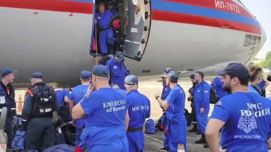 Russian Emergency Ministry employees leave one of two planes that landed in Myanmar following Friday’s earthquake.