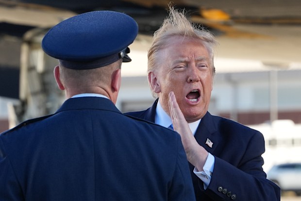 President Donald Trump yells as he arrives on Air Force One.