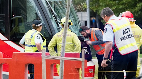 Emergency services at the scene of a collision between a tram and a pedestrian in Canberra on Saturday morning.