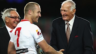 Ben Hornby shakes hands with Norm Provan after Hornby broke Provan’s record for number of first grade games for the Dragons.