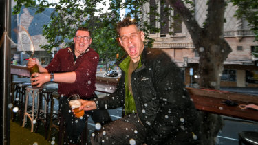 Managers at The Duke, Andy O'Brien and Tim Hale celebrates the good news from the Premier Daniel Andrews last night.