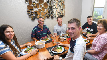 Just like home: British doubles players Neal Skupski (front, centre), and brother Ken (right, rear) are staying with the Lustig family of Caulfield North.