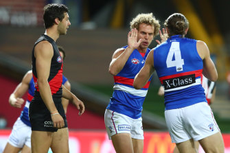 Mitch Wallis celebrates one of his three goals for the Bulldogs on Friday night.