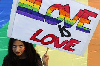 A participant holds a banner during the annual gay pride march in Belgrade, Serbia, which was disrupted by anti-gay protesters.