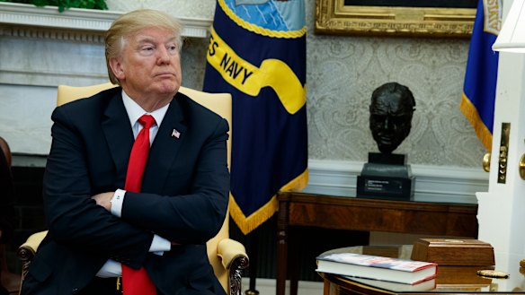 Donald Trump listens during a meeting with North Korean defectors at the WHit House in February.