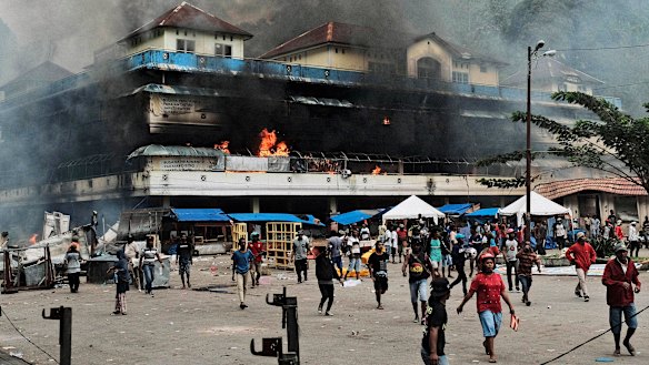 A local market is seen burning during a protest in Fakfak, Papua province, on August 21.
