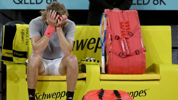 Stefanos Tsitsipas takes a moment after beating Rafael Nadal.