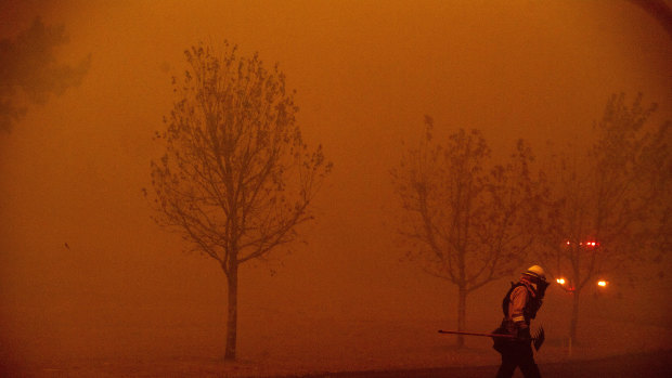 A firefighter battles a wildfire in Healdsburg, California, last weekend.