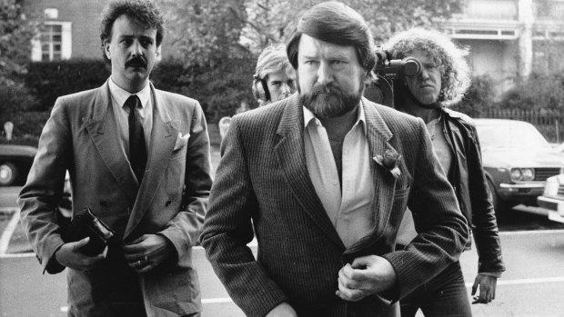 Derryn Hinch enters the Supreme Court to hear the verdict.