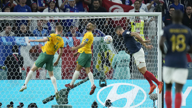 Australia concede from a cross again as France’s Olivier Giroud heads home.