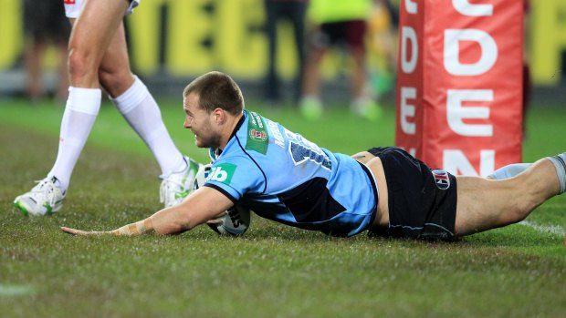 Trent Merrin scores under the posts in Sydney.