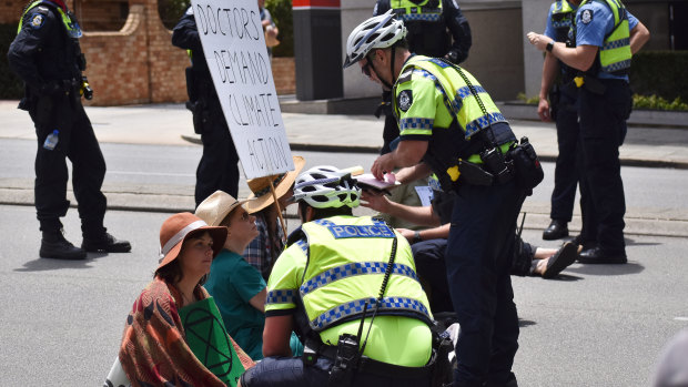 Protesters clash with police in the Perth CBD on Friday. 