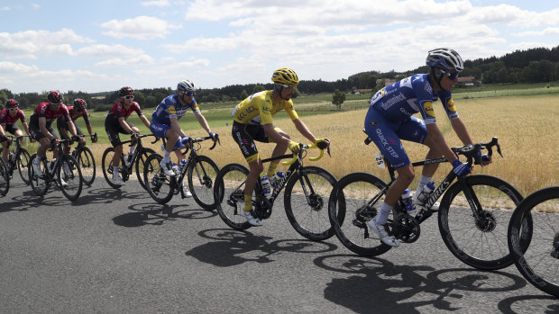 France's Julian Alaphilippe wearing the leader's yellow jersey on Bastille Day.