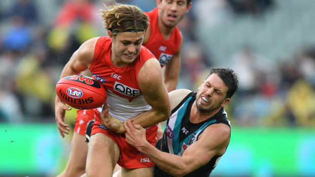 James Rowbottom is tackled during Sydney's loss to Port Adelaide.