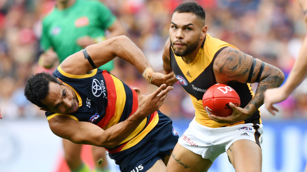 Poise: Hawk Jarman Impey controls possession under pressure from Adelaide's Eddie Betts.