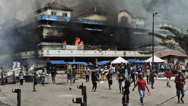 A local market is seen burning during a protest in Fakfak, Papua province, on August 21.