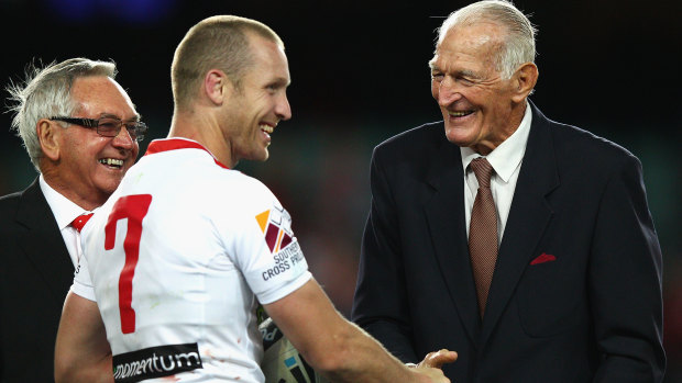 Ben Hornby shakes hands with Norm Provan after Hornby broke Provan’s record for number of first grade games for the Dragons.