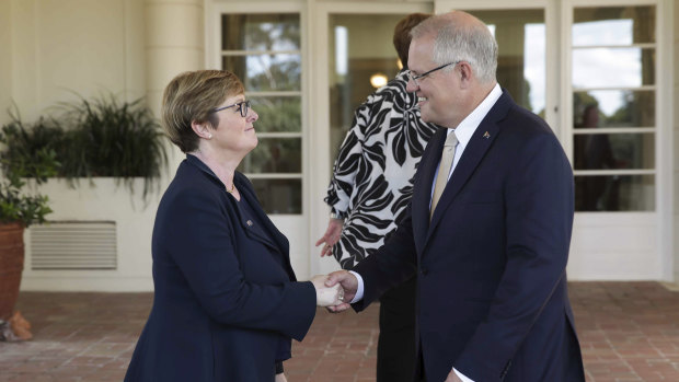 Prime Minister Scott Morrison with Senator Linda Reynolds after she was sworn in as Minister for Defence Industry at Government House in Canberra on Saturday.