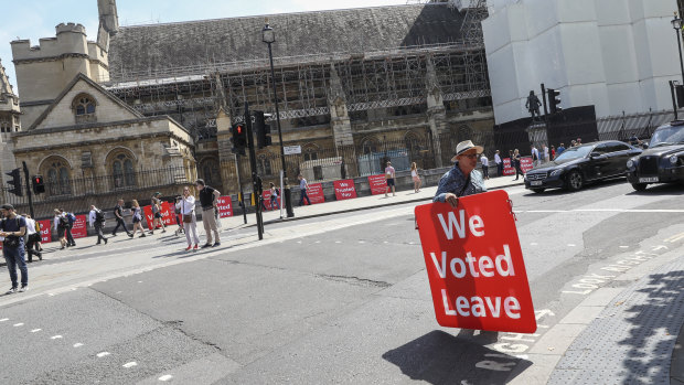 Some demonstrators gathered across the road near the Houses of Parliament on Wednesday.